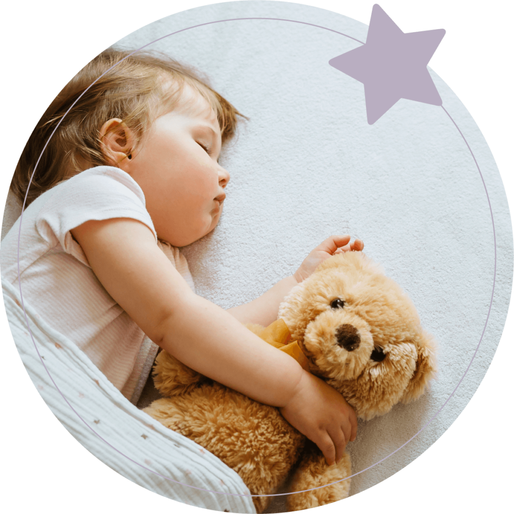 Sleeping child with teddy